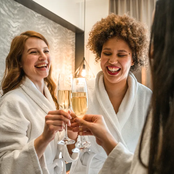 young women in bathrobes having a private spa party